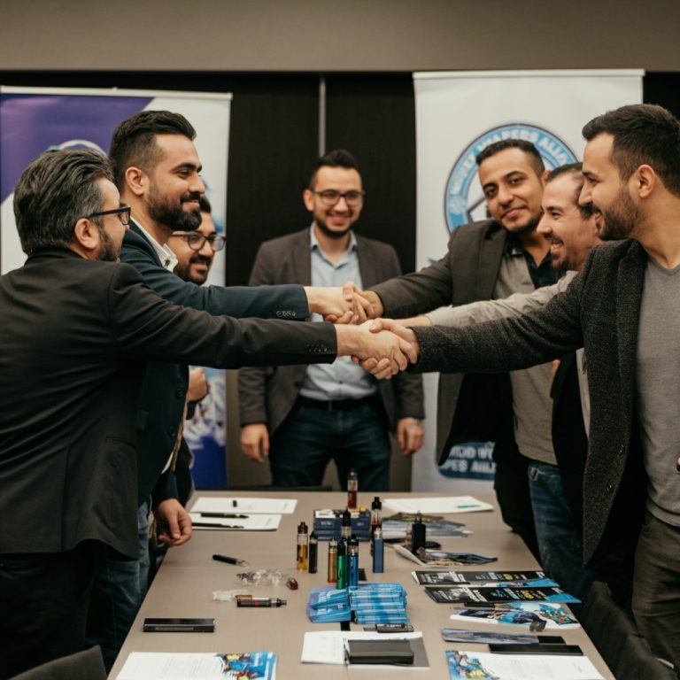A,Diverse,Group,Of,Vape,Advocates,Shaking,Hands,In,A